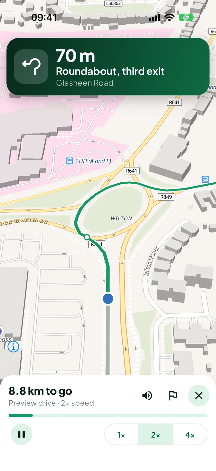 PassRoutes guiding a drive: a banner reads “70 m, Roundabout, third exit” above a map with the route in green.